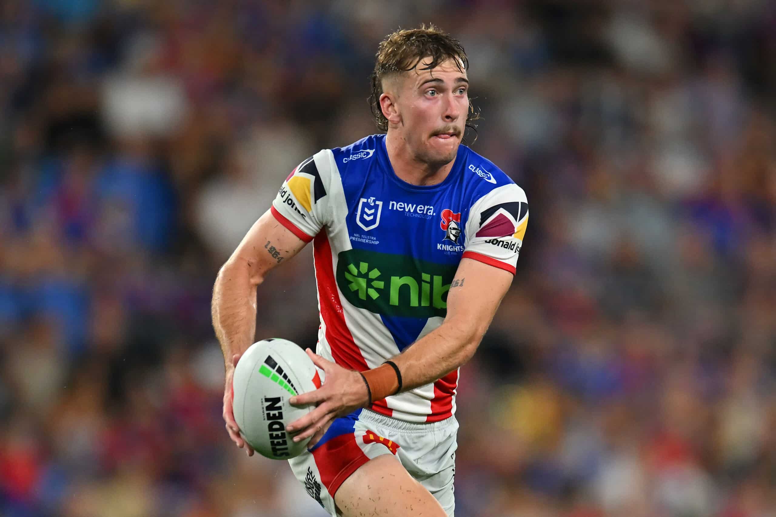 GOLD COAST, AUSTRALIA - MARCH 22: Fletcher Sharpe of the Knights runs with the ball during the round three NRL match between Gold Coast Titans and Newcastle Knights at Cbus Super Stadium, on March 22, 2025, in Gold Coast, Australia. (Photo by Albert Perez/Getty Images)